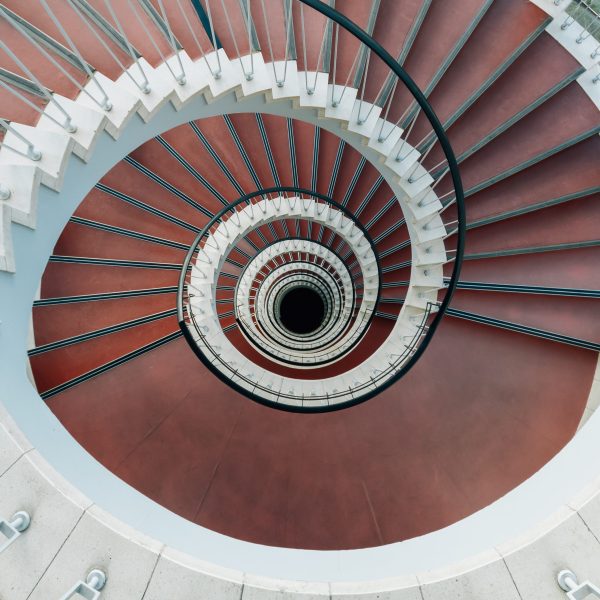 A high angle view of a modern spiral staircase under the lights